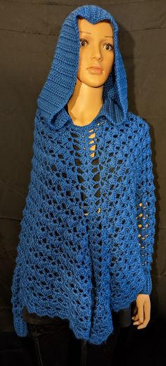 Pretty poncho to wear with hood and sleeves.   100% acrylic blue yarn. One size fits most. Comes from a pet friendly home. Item is handmade and may have some imperfections as that is what makes it unique. Hand Knitted Casual Poncho For Winter, Casual Hand Knitted Poncho For Winter, Handmade Winter Poncho Made Of Yarn, Handmade Yarn Poncho For Winter, Hand Knitted Yarn Poncho For Winter, Crochet Poncho With Hood, Hand Knitted Acrylic Yarn Poncho For Winter, Cozy Handmade Winter Poncho, Handmade Cozy Winter Poncho