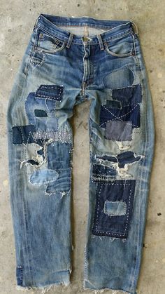 an old pair of jeans with holes and patches