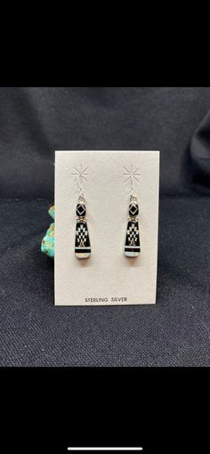 These Beautiful Earrings are micro-inlayed with Black Onyx and White Opal into genuine Sterling Silver! The intricate work is stunning in person and the earrings speak for themselves! Length: 1.25 Inches Width: .3 Inches Stones: Black Onyx, White Opal White Opal Earrings, Opal Earrings, White Opal, Black Onyx, Beautiful Earrings, Onyx, Jewelry Earrings Dangle, Opal, Dangle Drop Earrings