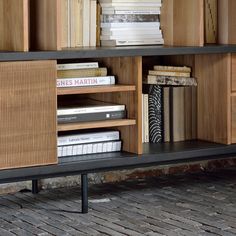 a book shelf with books and magazines on it