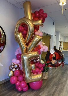 the balloon letters are in the shape of the number five and have been decorated with balloons