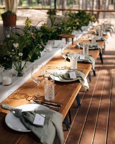 the long table is set with place settings