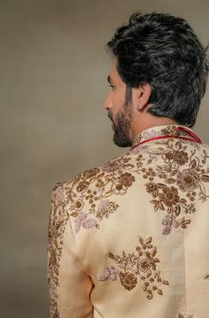 Frosted Almond Sherwani | Jatin Malik Introducing our masterpiece: the golden placement hand-embroidered sherwani. This exquisite sherwani showcases an intricate embroidery technique that utilizes various types of dabka and moti. The meticulous placement of these embellishments creates a stunning visual impact, highlighting the craftsmanship and artistry involved. Perfect for making a grand and elegant statement, this sherwani is a true testament to refined luxury and traditional excellence. Included in purchase: Sherwani, Kurta, Churidar Product Specification Color: Golden Fabric: Linen silk Occasion: Engagement, Wedding, Bridal, Reception Style: Sherwani, Kurta, Churidar Care: Dry Clean Work: Hand Embroidery Customization options:Can be customized in any color or style Note: A stylist wi Luxury Ceremonial Sherwani In Traditional Drape, Luxury Embroidered Sherwani, Luxury Ceremonial Chanderi Sherwani, Luxury Cotton Silk Sherwani With Pallu, Luxury Georgette Sherwani With Intricate Embroidery, Luxury Embellished Elegant Sherwani, Luxury Pink Sherwani With Traditional Drape, Luxury Pink Sherwani For Transitional Season, Jatin Malik