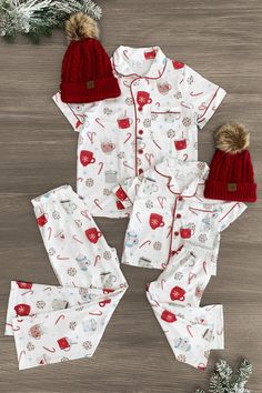 *Adult & child sets sold separately* Pajama set comes with a short sleeve top and matching pants White cookies & hot cocoa print fabric lends sweet, seasonal charm Soft fabric provides cozy, all-night comfort Perfect for bedtime or relaxing movie nights in Cozy up with some hot cocoa this season in our matching Cookies & Hot Cocoa Pajamas! These pajama sets come with a short sleeve button-up top and pair of matching pants. Both pieces are made from a soft fabric blend for comfortable wear, with Christmad Pajamas, Pajama Gift Basket Ideas, Cute Christmas Pjs, Maternity Christmas Pajamas, Christmas Family Pjs, Baby Christmas Pjs, Matching Christmas Pajamas Family, Brr Basket, Kids Christmas Pajamas