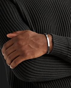 Whether you're looking for a traditional look or something newer, this cuff for men is a timeless piece of jewelry that you can wear for official events and everyday life.When choosing a men's jewel, ensure the style and material match your outfit. Choosing a comfortable men's bracelet is essential in ensuring it fits perfectly.Their exteriors and minimal shape allow the precious metal plating to shine through. You can wear them alone or with other minimal accessories with similar tones. This is the perfect piece to accessorize your wardrobe. Metal: 925 Sterling Silver / 24k Gold Plated / Rhodium over 925 Sterling Silver Dimensions: 6 mm W One Size Fits Most The cuff can open and close, is a malleable metal and carefully can adjust to your wrist. Type: Cuff 100% Handcrafted Package: High q Mens Wrist Accessories, Men Bracelet Silver, Men Silver Bracelet, Mens Accessories Bracelet, Mens Cuff Bracelets, Mens Bracelets, Minimal Accessories, Mens Bracelet Silver, Mens Gold Bracelets