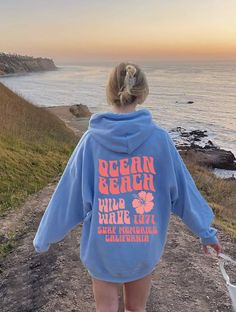 ocean beach trend oversized hoodie, pinterest unisex cozy sweatshirt, preppy y2k cute sweatshirt, blue hoodie with sayings, aesthetic beach This unisex heavy blend hooded sweatshirt is relaxation itself. Made with a thick blend of cotton and polyester, it feels plush, soft and warm, a perfect choice for any cold day. In the front, the spacious kangaroo pocket adds daily practicality while the hood's drawstring is the same color as the base sweater for extra style points. .: 50% cotton, 50% polye Vsco Style Relaxed Fit Sweatshirt With Letter Print, Vsco Style Hoodie Sweatshirt With Letter Print, Y2k Oversized Letter Print Sweatshirt, Oversized Y2k Hoodie With Letter Print, Oversized Y2k Sweatshirt With Letter Print, Blue Graphic Print Sweatshirt For Summer, Blue Graphic Print Summer Sweatshirt, Oversized Long Sleeve Vsco Hoodie, Oversized Y2k Hoodie For Spring