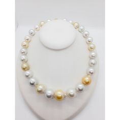 Beautiful estate necklace showcasing 27 white and yellow South Sea pearls and 0.50 ct. of white diamond rounds in a 18k yellow gold clasp.  Superb luster and minimal to no blemishes. The alternating white and yellow pearls make this classic necklace unique and fun.  Mint condition.  Metal: 18k Gold Stone: Diamond,South Sea Pearl Stone Cut: Round Cut  Dimensions for the item are unknown. Please reach out in the seller Q&A with questions Luxury High Luster White Pearl Necklace, Yellow Pearl Necklaces With Round Beads, White High Luster Round Beads Necklace, White High Luster Round Bead Necklaces, White High Luster Round Beaded Necklaces, White High Luster Pearl Necklaces, White Akoya Pearl Necklace With High Luster, Elegant Yellow Pearl Necklaces, Elegant Yellow Pearl Necklace