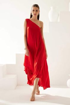 Red one shoulder asymmetric dress in a draped solid base. - Aza Fashions Red Sleeveless Asymmetrical Dress, Red Sleeveless One-shoulder Dress For Spring, Red Sleeveless One Shoulder Dress For Spring, Red One Shoulder Sleeveless Dress For Spring, Red Sleeveless One Shoulder Summer Dress, Red Draped Maxi Dress For Summer, Red Draped Midi Dress For Summer, Solid One Shoulder Asymmetrical Dress For Summer, Solid One-shoulder Asymmetrical Dress For Summer