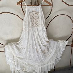 Excellent Vintage Condition Worn Once Less Trough Beige A-line Bohemian Dress, Sleeveless Boho Dress For Garden Party, Elegant Sleeveless Flowy Boho Dress, Elegant Flowy Sleeveless Boho Dress, Bohemian Beige A-line Dress, Elegant White Boho Midi Dress, Chic Fitted Sleeveless Boho Dress, Elegant Flowy Sundress With Lace Trim, Bohemian A-line Dress With Lace Trim