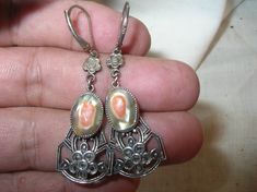 "Up for your consideration is these Vintage Sterling Drop Earrings. These gorgeous vintage sterling earrings feature a blister pearl centerpiece surrounded by marcasites throughout the piece. Pictures will best capture the natural vintage beauty of these earings. Measurements include approx 2\" L x 1/2\" W and a weight of approx. 7.4 grams. I have acid tested both pieces and sterling verified. Please do not hesitate to contact me with any question at the consideration of purchase." Pearl Centerpiece, Vintage Beauty, Sterling Earrings, Jewelry Earrings Dangle, Etsy Earrings, Dangle Drop Earrings, Pearl Earrings, Dangle Earrings, Etsy Accessories