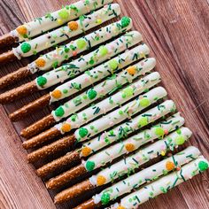 the pretzels are decorated with green sprinkles and white frosting