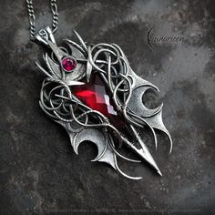 NYRNHYR - Exclusive gothic, vampire, fantasy style necklace. Fully handmade work (wire wrapping technique with oxidizing and polished silver). Main base gem: Red Quartz 11,5 Ct (2,3g). Additional stones: Cubic Zirconia. Material: silver (Sterling Silver, Fine Silver / 925, 999). We use only high-quality silver. Our silver does not contain harmful nickel.  Chain length: 42 cm + 7 cm, Figaro, with a decorative clasp, adjustable. Pendant length: 6,2 cm, width: 3,5 cm. Pendant weight: approx 20g. Co Gothic Red Necklace For Cosplay, Red Gothic Necklace For Cosplay, Medieval Jewelry For Halloween Gift, Handmade Vampire Jewelry For Cosplay, Handmade Vampire Style Jewelry For Cosplay, Gothic Wire Wrapped Pendant Jewelry, Red Fantasy Jewelry For Cosplay, Artifact Art, Wire Wrapping Techniques