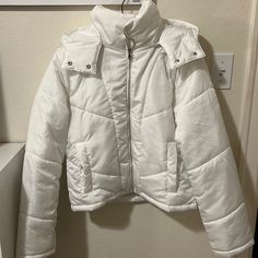 White Puffer Jacket Light Weight With Detachable Hood Two Front Pockets With Button Close Brand New, Never Worn! White Puffer Jacket With Padded Collar For Cold Weather, White Outerwear With Buttons For Fall, White Buttoned Outerwear For Fall, White Outerwear With Button Closure For Fall, Trendy White Winter Outerwear, White Button Closure Outerwear For Fall, Trendy White Outerwear For Fall, White Winter Puffer Jacket With Pockets, White Cold Weather Outerwear With Button Closure