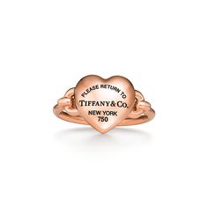 A bold expression of love, inspired by those who fill up your heart. Tiffany artisans have transformed the classic Return to Tiffany® tag into a three-dimensional heart with a special casting technique. The 18k rose gold pieces in this collection feature layers of black rhodium applied by hand for a striking finish. Playfully proportioned, each heart is hand polished for maximum shine. 18k rose gold; Motif size, mini | Return to Tiffany® Full Heart Ring in Rose Gold, Size: 7 Return To Tiffany Ring, Gold Tiffany Ring, Tiffany And Co Jewelry Gold, Tiffany Gold Ring, Tiffany Ring, Tiffany Co Rings, Gold Tiffany, Gold Motif, Tiffany Rings