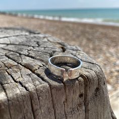 .925 Sterling silver adjustable ring.  A chunkier version of our rings for men (or women of course) with hammered effect  6mm x 1.5 mm Each letter is individually hand stamped by myself, with your own names, dates or choice of words. (up to 20 characters per line) A heart or star can be added by simply adding an emoji or (Heart) (Star) where you would like it placed.  For example  (Star) we love you daddy  Elsie and Charlie  Adjustable size, so one size fits all.  To adjust gently pull or push t Raspberry Ripple, Hammered Band, First Fathers Day, Secret Messages, Open Ring, Adjustable Ring, Stackable Rings, Adjustable Rings, Hand Stamped