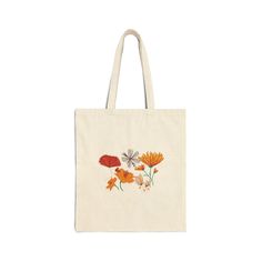 This 100% cotton bag comes in one size - 15" x 16"- perfect for everyday wear. While the canvas material will show off your designs in great colors, it's durable and will last for years. The bag features 20" handles (made from the same canvas), making it easy to carry even with a week's worth of shopping. .: 100% cotton canvas .: Heavy fabric (12 oz/yd² (406.9 g/m .: Sewn-in label .: Available in natural and black colors Flowers Tote Bag, Flowers Tote, Cotton Bag, Sew-in Labels, Canvas Material, Spring Flowers, Cotton Canvas, Everyday Wear, Handles