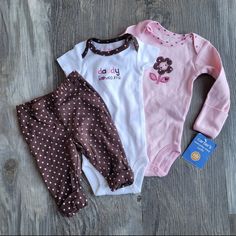 3 Piece Daddy Loves Me Set, Includes Chocolate And Pink Polka Dot Pants With Cuff At Ankle, A Short Sleeve Onesie With Embroidery And A Long Sleeve Onesie With Flower And Scratch Mittens! Pink Cotton Pants For Playtime, Playful Pink Cotton Pants, Pink Cotton Playwear Pants, Pink Cotton Pants For Playwear, Cute Pink Cotton Pants, Fitted Cute Cotton Sets, Cute Cotton Pants For Playwear, Cute Pink Bottoms For Playtime, Fitted Cute Pink Pants