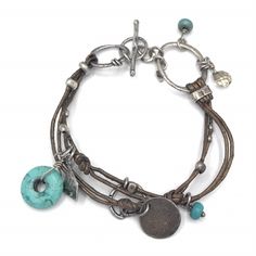 B2086 Retired Silpada Mixed Metal Bracelet Silpada Bracelet Consists Of Sterling Silver, Howlite, Smoky Quartz And Leather Bracelet. It Fits Up To A 7 " Wrist And Has An Adjustable Toggle Clasp. Can Be Found In The 2011-2012 Catalog Page 68a. New For $84.00. In Excellent Condition, Display Only, Never Worn. Silver Bohemian Bracelets For Everyday, Bohemian Silver Bracelets For Everyday, Nickel-free Silver Leather Bracelet, Mixed Metal Bracelet, Mixed Metal Bracelets, Boho Style Bracelets, Zero Tolerance, Silpada Jewelry, Metal Bracelet