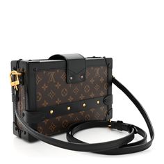 This is an authentic LOUIS VUITTON Monogram Petite Malle in Black. This trunk-style bag is crafted of Louis Vuitton monogram on coated canvas. The bag features black leather trim, an optional, adjustable black leather shoulder strap, and crossover top flap with gold-toned press lock and buckles on either side. The corners are reinforced with black hardware end caps. The bag opens to a beige leather interior with a patch pocket. Lv Side Trunk Bag, Crossover Top, Trunk Bag, Black Hardware, Leather Interior, Leather Trim, Authentic Louis Vuitton, Leather Trims, Crossover