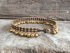 This choker necklace made with 8mm brass bells and brass bead woven together with dark brown waxed cord and brass bell for closure. It's jingling sound when you move! Bracelet: https://www.etsy.com/listing/85171763/brass-bells-dangle-bracelet-wedding Anklet: https://www.etsy.com/listing/160411751/brass-bell-dangle-anklet *Size: Choose your size or color of cord from the drop-down menu. **If you need silver version instead of brass, just take note to me in ther message to seller. *✈️ Shipping.. T Adjustable Festival Jewelry With Bells, Adjustable Bells Jewelry For Festivals, Choker Necklace Wedding, Collar Hippie, Wedding Anklets, Dangle Bracelet, Wedding Women, Brass Bell, Hippie Necklace