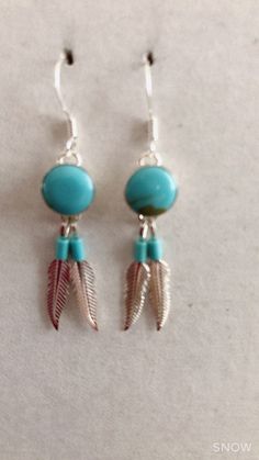 * Handmade item *925 Sterling silver * Gemstone: Kingman Turquoise *Dangle drop Earrings * 8mm Round Stone with 2 Feathers *Free gift box *Free shipping in USA *Ready to ship *Thank you for looking and check out more items in my Etsy shop for more great items and deals! *Https://www.etsy.come/shop/abq925 Adjustable Blue Feather Earrings, Turquoise Feather Jewelry As Gift, Turquoise Feather Jewelry As A Gift, Adjustable Turquoise Jewelry With Feathers, Adjustable Silver Earrings With Feathers, Adjustable Silver Feather Earrings, Southwest Jewelry, Handmade Earrings Beaded, Turquoise Bead Necklaces