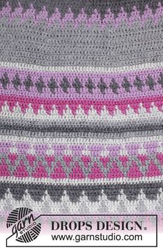 a crocheted blanket with pink, grey and white designs on the edges is shown