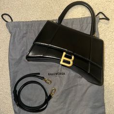 Great Condition, Carried Three Times. Looks Brand New. Dust Bag Included Can Provide Original Receipt/Proof Of Purchase. Black Shoulder Satchel, High-end Formal Satchel, Designer Business Shoulder Bag, Designer Square Satchel With Branded Hardware, Formal Top Handle Shoulder Bag With Original Box, Designer Square Satchel With Gold-tone Hardware, Designer Black Top Handle Bags, Designer Black Top Handle Shoulder Bag, Designer Black Bags For Office