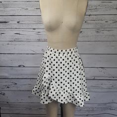 Polka Dot Faux Wrap Skirt Women's Size Small Tie At Waist Can Be Tied In A Bow In Front Or Back. Elastic Pull On Waistband Bottom Hem Ruffle Polka Dot Skirted Bottoms For Spring, Spring Polka Dot Skirted Bottoms, Casual Fitted Polka Dot Mini Skirt, Fitted Polka Dot Mini Skirt For Spring, Casual Polka Dot Mini Bottoms, Trendy Polka Dot Skirt For Spring, Spring Polka Dot Mini Skirt, Polka Dot Mini Length Bottoms For Spring, Polka Dot Mini Bottoms For Spring