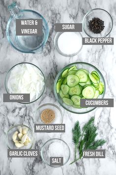 the ingredients to make cucumber salad laid out on a marble counter top with names