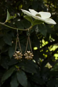 These are wonderfully detailed dogwood flower earrings for all you fellow dogwood tree lovers, flower lovers, and botanical besties out there. They are a great medium size dangle earring and are super lightweight, yet durable, made of solid (not plated) raw brass with solid sterling silver ear hooks. There are two finishes you can choose from either with a patina to enhance the antique feel and highlight the texture, or shiny. Please select your preference from the drop down menu length: 2 1/2 i Vintage Metal Flower Earrings, Vintage Flower Charm Dangle Earrings, Vintage Flower Shaped Earrings, Vintage Flower-shaped Pierced Earrings, Vintage Gold Earrings With Flower Charm, Vintage Drop Earrings With Flower Charm, Vintage Nickel Free Metal Flower Earrings, Vintage Dangle Flower Earrings For Gift, Vintage Flower Drop Earrings For Gift