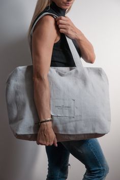 Light roomy linen tote bag in light gray, large shoulder canvas tote bag, roomy beach bag in minimal style, zippered woman tote bag Light and roomy linen tote bag with zipper, crafted from softest prewashed linen,  you can use it as shopper bag, summer beach bag or everyday bag. On the foto there is linen in light gray color- outside, inside is white Tyvek.  The bag's handles are very comfortable. The linen bag allows you to complement your styling or becomes its main point, no matter where you Summer Beach Bag, Linen Tote Bag, Large Beach Bags, Studio Bag, Summer Tote Bags, Summer Tote, Bag Fabric, Bag Summer, Zipper Tote Bag