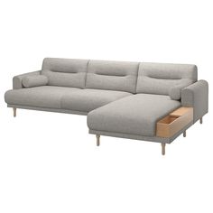 a gray couch with a wooden foot rest and storage drawer on the bottom right side