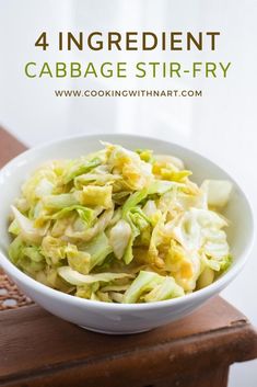 cabbage stir fry in a white bowl on top of a wooden table with text overlay reading 4 ingredient cabbage stir fry