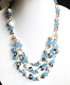 Handmade beaded Blue crystal necklace, pearl and crystal necklace, statement blue pearl necklace, multi strand and one of a kind necklace Elegant Light Blue Beaded Chain Necklaces, Elegant Light Blue Beaded Chain Necklace, Blue Pearl Necklace With Colorful Beads, Blue Pearl Necklaces With Colorful Beads, Elegant Blue Pearl Necklace With Colorful Beads, Multi-strand Pearl Beaded Necklace With Faceted Beads, Elegant Blue Pearl Beaded Necklaces, Elegant Blue Beaded Pearl Necklace, Blue Pearl Jewelry With Colorful Beads