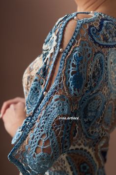 the back of a woman's dress with crochet