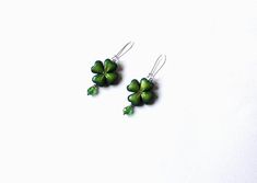 clover earrings, shamrock earrings, polymer clay jewelry, St.Patricks Day gift, clover jewelry, green earrings, Irish gift, Shamrock jewelry, Ireland symbol, green Leaf jewelry, Four Leaf clover, St.Patrick costume, trefoil jewelryclover earrings Lucky Four Leaf made by me from polymer clay. A smooth transition of color on leaf clover gives it originality. In the middle of the sheet - Swarovski crystals, very beautiful shimmers in daylight and artificial light. On a leaf of slight toning PearlEX Handmade Green Sterling Silver Flower Earrings, Handmade Green Flower Earrings In Sterling Silver, Green Dangle Polymer Clay Jewelry, Green Polymer Clay Jewelry With Matching Earrings, Green Hypoallergenic Polymer Clay Earrings, Hypoallergenic Green Polymer Clay Earrings, Elegant Green Polymer Clay Jewelry, Green Polymer Clay Flower Drop Earrings, Shamrock Jewelry