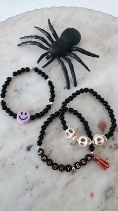 Spooky Season has arrived...and so has our curated collection of Halloween stacking bracelets for this season. These bracelets are great for adding with your personalized stack to give a fun festive look. Having a party? These would make great little party favors -- especially for kids birthdays Halloween themed! We can even custom create bracelets using specific colors -- just message us to create a custom bracelet!  ≫ PRODUCT DETAILS ◈ 1. All bracelets are sold separately  ◈ 2. If needing a cu Halloween Friendship Bracelet Beads, Halloween Gift Bracelets With Letter Beads, Halloween Party Beaded Bracelets, Halloween Bracelets With Letter Beads And Round Shape, Personalized Halloween Beaded Bracelets, Halloween Letter Beads Bracelet With Round Beads, Halloween Jewelry With Round Letter Beads, Personalized Beaded Bracelets For Halloween, Customized Beaded Bracelets For Halloween Gift