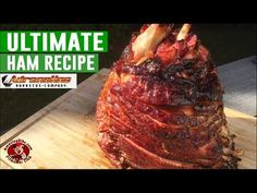 a large piece of meat sitting on top of a wooden cutting board with the words ultimate ham recipe over it