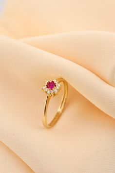 14k Solid Gold Daintly Flower Ring - Minimalist Wedding Ring - Anniversary Ring - Gold Floral Ring - Red Stone Flower Ring This solid gold dainty ring is made entirely from 14k solid gold. * Jewelry is packaged and shipped in a delicate jewelry gift box. * If you are purchasing it as a gift, please feel free to add a personal note. Anniversary, Gift For Wife, Christmas Gift Gold Kt: 14K solid gold * Available Gold Color:  * Guaranteed Authentic 14k Gold, Not Plated Or Filled * Stamp: 14K Gold Ring Designs Flower, Delicate Gold Ring For Proposal, 14k Gold Solitaire Flower Ring For Wedding, Gold Ruby Flower Ring, Dainty Yellow Gold Birthstone Ring For Proposal, Red 14k Gold Rings With Halo Design, Elegant Flower-shaped Birthstone Ring For Wedding, 14k Gold Red Halo Rings, Flower-shaped Yellow Gold Ruby Ring For Wedding