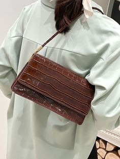 Croc Embossed Baguette Bag - Women Shoulder BagsProduct Description Color Coffee Brown Pattern Type Crocodile Style Elegant Bag Size Small Quantity 1 piece Magnetic Yes Type Square Bag Coating 100% Polyurethane Composition 100% Polyurethane Material PU Leather Size Chart INCH CM Size Bag Width Bag Height Bag Length one-size 3.1 5.1 9.4 Size Bag Width Bag Height Bag Length one-size 8 13 24 Similar Products h2 { text-align: center; } .red-box { width: 100%; display: flex; flex-direction: row; flex Elegant Bags, Crocodile Print, Brown Pattern, Color Coffee, Coffee Brown, Makeup Essentials, Trendy Fashion Women