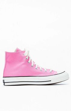 Step into timeless style with Converse's Pink Chuck Taylor All Star 70 High Top Sneakers. These iconic kicks blend vintage aesthetics with modern comfort, featuring premium materials and the classic Chuck Taylor design that effortlessly elevates your casual look..PLEASE NOTE: This shoe is offered in men's sizes; the conversion for Converse shoes is a size and a half smaller for women. For example, a woman who is a size 7 should order a size 5.5 in men's..Canvas upper.Lace-up front closure.High-top silhouette.Contrast stitching.Metal eyelets.Converse branding.Chuck Taylor All Star ankle patch Retro Pink High-top Sneakers With Rubber Sole, Converse Pink High-top Sneakers With Gum Sole, Pink Cotton High-top Sneakers For Spring, Retro Pink High-top Sneakers With Round Toe, Vintage Pink Sneakers With Round Toe, Pink Cotton Sneakers With Vulcanized Sole, Retro Converse Sneakers For Spring, Vintage Pink Low-top Sneakers, Vintage High-top Sneakers For Spring