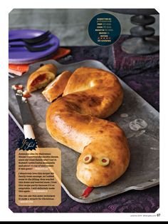 the bread is shaped like an eyeball and has googly eyes