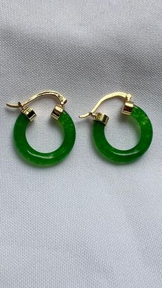 Dark green Jade earrings, Green Jade hoop earrings, Green hoop earrings, Gemstone earrings for women, gold filled earrings, Statement Earrings  These Unique and Trendy Dark Green Jade 18 Kt gold filled hoop earrings are definitely an eye candy to step up your outfit, can be worn for any event or special occasion. The ideal gift for you , mom, daughter, girlfriend, wife or special someone.  Material  . 18 Kt Gold Filled  . Brass  . Jade Gemstone  Size  . 1" inches  length ( approximately)  Thank you so much for taking your time to check my Shop . Follow me on instagram @jewelrybyana for more trending accessories ideas. Green Jade Earrings For Pierced Ears, Elegant Jade Hoop Earrings, Elegant Green Huggie Jewelry, Jade Hoop Earrings For Gift, Green Jade Earrings For May Birthstone, Small Hoop Green Earrings For May Birthstone, Green Round Earrings For May Birthstone, Green Earrings For May Birthstone, Single Green Round Earring