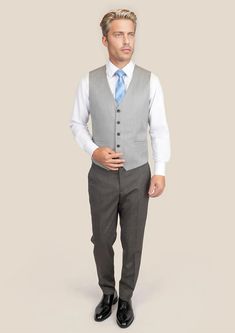 Complete your ensemble with our premium Glacier Grey Twill Vest. Cut from luxurious Super 110's 100% merino wool by Vitale Barberis Canonico, this custom-made vest adds the final touches to a sophisticated and classic style. Perfect for any occasion, its versatility will easily take you from day to night. Tailored Wool Vest For Semi-formal Occasions, Winter Semi-formal Slim Fit Vest, Formal Winter Sleeveless Vest, Formal Sleeveless Winter Vest, Elegant Semi-formal Wool Vest, Elegant Sleeveless Business Vest, Elegant Sleeveless Vest For Business, Formal Wool Vest With Notch Lapel, Slim Fit Formal Vest For Winter