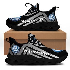 a pair of black and white sneakers with volkswagen logos on them