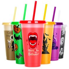 six different colored cups with halloween designs on the lids and straws in each cup