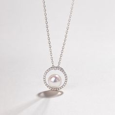 Material: 18K white gold, Akoya Pearl, and diamond Akoya saltwater cultured pearl Size of pearl: around 6.5-7.0 mm Pendant Size: Overall diameter 11.5mm Weight of Diamonds: 30 diamonds approx. 0.115 carats Handpicked of every pearl, only the top 1% of pearls are selected Handcrafted Lifetime warranty The pearl strand necklace worn by the model is PFN0110-KY-15 The price of this product is only the pendant price, and a 45cm adjustable 925 silver chain is given as a gift. Formal Sterling Silver Necklace With Pearl Pendant, Elegant Sterling Silver Pearl Necklace With Clavicle Chain, Luxury White Necklace With Round Stone, Luxury Pearl Charm Round Jewelry, Luxury Round Pearl Charm Jewelry, Refined Sterling Silver Diamond Necklace, Pearl White Round Pearl Necklace, Exquisite Pearl Chain Necklace For Anniversary, Formal Sterling Silver Necklace With Pearl Chain