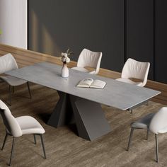 a dining table with white chairs and a book on the top is in an empty room