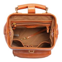 Even the chicest among us encounter circumstances when only a backpack will do. But function and fashion don't have to be mutually exclusive, vegetable-tanned Genuine Leather and Antique Gold Hardware transform our Doctor Backpack from a traditionally utilitarian carryall into a stylish accessory. PRODUCT FEATURES 100% Genuine Leather 100% Recycled Nickle-Free Hardware 100% Interior Cotton Lining 100% Vegetable Base Dyes 100% Handcrafted Push-Lock Clasp Removable Shoulder Straps Adjustable Shoulder Straps Protective Metal Feet Antique Brass Hardware Multi-Pocket Compartments Interior: (1) Zipper Pocket, (2) Slip Pockets, (1) Key Hook Exterior: (1) Front Zippered Pocket PRODUCT DIMENSIONS 10" Width x 12" Height x 5" Depth (Inches) Handle Drop: 2" (Inches) Shoulder Drop: 16"-21" (Inches) STY Classic Leather Backpack With Detachable Strap For Daily Use, Classic Leather Backpack With Detachable Strap For Everyday, Luxury Leather Satchel Backpack For Daily Use, Classic Top Handle Backpack For Daily Use, Luxury Rectangular Leather Backpack For Daily Use, Satchel Backpack For Everyday Use, Everyday Use Brown Backpack With Detachable Handle, Cognac Leather Backpack For Everyday Use, Vintage Rectangular Leather Backpack For On-the-go