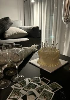 a table topped with wine glasses and a cake